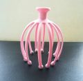 scalp massager, also commonly known as a head massager or head scratcher..