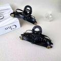 1/2 PC 2026 Y2K ladies' new street style elegant gold label black leather butterfly knot large-sized matte clutch hair accessory. 