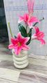 Artificial lily flower with ceramic vase. 