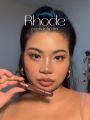 Rhode “The Peptide Lip Tint" shade number Espresso. 
