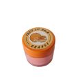 Starry fruit lip balm in orange flavor. 