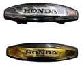 FRONT MONOGRAME AND REFLECTOR HONDA 125,unique,super star ،super power  UNIVERSAL FITTING USE IN ALL BIKES GOLDEN SHADE 70cc+125cc. 