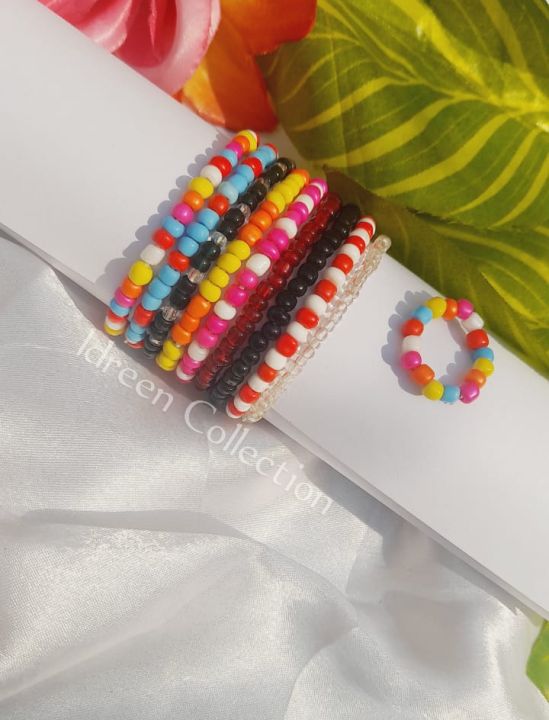 09Pcs of Elastic Beaded Bracelets with one ring free in Random colors ...