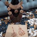Bridal Jewellery set in Red and Golden colour with beautiful Crystal mala, bindeya and jhumer. 