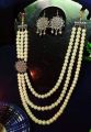 Ghee & silver color mixed circle design beautiful garland made of flower and pearl for women. 