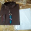brown colour kurta and white colour shalwar. 