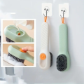 1pc Multi-function automatic spot shoe brush soft hair hand pressure hanging hole suitable for clothing carpet plastic handles. 
