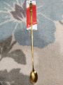 Ss tall golden colour tea spoon. 