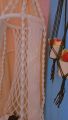 .macrame swing hanging chair in white color. 