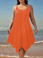 Large women's solid color asymmetrical hem camisole dress. 