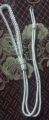 High quality metal whistle with white Dori cord. 