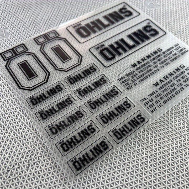 Ohlins Suspension Shocker Damper Motorcycle Decals - Transparent Adhesive Stickers with Warning Labels for Enhanced Performance
