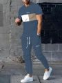 Men's 2025 Summer Splicing Letter 3D Printed Pattern Breathable Quick Drying Top Trendy Soft Top Street Round Neck T-shirt Set.