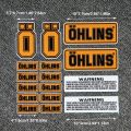 Ohlins Suspension Shocker Damper Motorcycle Decals - Transparent Adhesive Stickers with Warning Labels for Enhanced Performance.