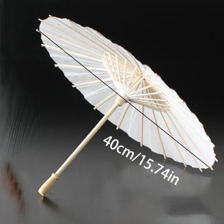 A%20white%20paper%20umbrella%20for%20wedding%20decoration%20-%20handmade%20traditional%20Chinese%20bridal%20sunshade%20-%20photo%20prop%20and%20party%20accessory%20-%20Image%204