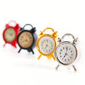1 piece of dollhouse miniature metal alarm clock: 1/12 mini simulation bedroom scene decoration model (sticker random).