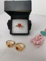 1k  bridal gold ring with maroon stone.. 