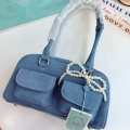 Cicelle shoulder bag oven modern denim fabric with Pearl knot pendant. 
