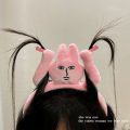 Fun raising hands, pulling hair, pink rabbit headband, funny headband, grabbing bangs, tying hair, cartoon headband. 