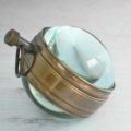 (H).  VTG Brass Eye of Time Per Mare Per Terram By Land Watch
  Brass Table clock Nautical shelf & desk clock. 