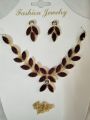 maroon stone necklace with earings. 