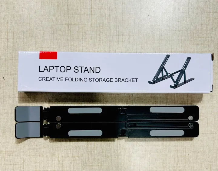 Portable%20Aluminum%20Foldable%20Laptop%20Metal%20Stand%20Adjustable%20Height%20Folding%20Laptop%20Holder%20Solid%20Stand%20With%20Anti%20Slip%20Rubber%20Grips%20-%20Silver%20-%20Image%207