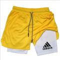 2-in-1 running shorts, suitable for men's fitness leggings, with phone pocket and simple letter print for summer sports pants.