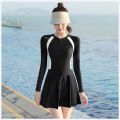 Women’s Long Sleeve Swimsuit with Skirt and Attached Shorts. 