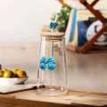 Transparent Bow Glass Cup with Bamboo Lid & Straw – Perfect for Juice, Coffee & Smoothies (Random color). 