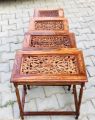 Wooden crafted Nested 4 table set. 