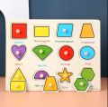 Wooden Puzzle Shapes Board With Colour. 