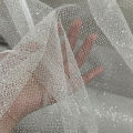 Shiny spray silver bronzing fabric medium hard diy wedding dress fabric background layout grid shiny net.