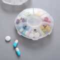 7 Compartments Portable Round Mini Plastic Pill Box Medicine Box Travel Pill Storage Case 7 Days Weekly Pill Organizer.