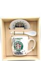 Starbucks mug with spoon and top. 