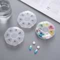 7 Compartments Portable Round Mini Plastic Pill Box Medicine Box Travel Pill Storage Case 7 Days Weekly Pill Organizer. 