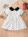 Stylish Black & White Polka Dot Dress for Girls – Classic Peter Pan Collar.
