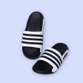 Stridez Classic Triple-Line Slides – Black & White Edition.