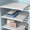 Scalable partition layer clothing storage rack. 