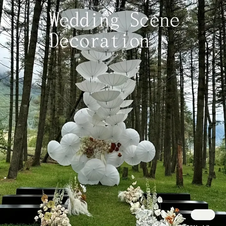 A%20white%20paper%20umbrella%20for%20wedding%20decoration%20-%20handmade%20traditional%20Chinese%20bridal%20sunshade%20-%20photo%20prop%20and%20party%20accessory%20-%20Image%205