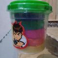 Play dough clay jambo size jar different color in a bucket. 