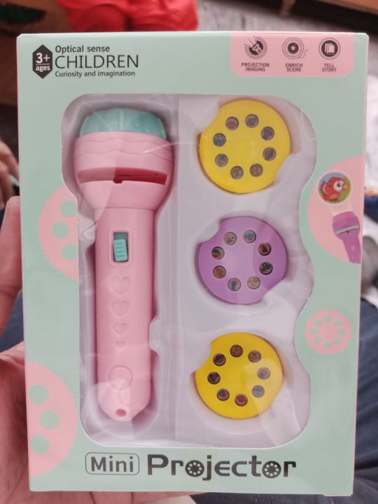 Mini%20Projector%20For%20Kid's%20Torch%20Projector%203%20Slides,%2024%20Patterns%20Projector%20Flashlight%20Torch,%20Kids%20Projection%20Light%20Toy%20Education%20Learning%20Best%20Gift%20for%20Kids%207%20Ys%20boy%20or%20Girl%20-%20Image%202