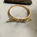 (C). Kate Spade Bow Bangle Bracelet. 