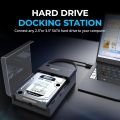 USB 3.0 to SATA External Hard Drive Lay-Flat Docking Station (model EC-DFFN or similar) with a WUSB 3.0 to SATA External Hard Drive Lay-Flat Docking Station (model EC-DFFN or similar) with a W-t-ern Digestern Digital (W-D) Green 14TB hard drive inserted. .