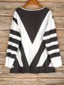 Plus Size Women's V-Neck Geometric Striped Long Sleeve Top with Zipper Detail for Chic and Modern Style. 