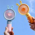 Rechargeable Stylish Cartoon Shape Mini Turbo Fan With Mobile Holder For Indoor & Outdoor Use -  Multicolor. 