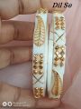 Uniqe and Gorgious Golden Metal Leaf designed Works Plastic Shakha Pola Bangles. It's for Women White , Party , Wedding , Anniversary , Durga Puja & All Time Use.. 
