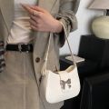This year's popular bow handbag bag women's 2024 spring and summer new fashion foreign shoulder armpit small square bag. 