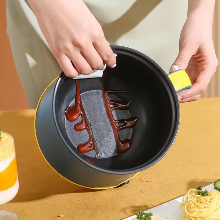 Portable%20Electric%20Multicooker%20Rice%20Cooker%20%E2%80%93%201.8L%20Stainless%20Steel%20Non-Stick%20Cooking%20Pot%20with%20Steamer,%20300W/600W%20Dual%20Power,%20Compact%20Travel%20Cooker%20for%20Rice,%20Noodles,%20Soups%20&%20Stews%20%E2%80%93%20Quick%20Heating%20Multipurpose%20Cooker%20for%20Home%20&%20Dorm%20Simplicity%20-%20Image%204