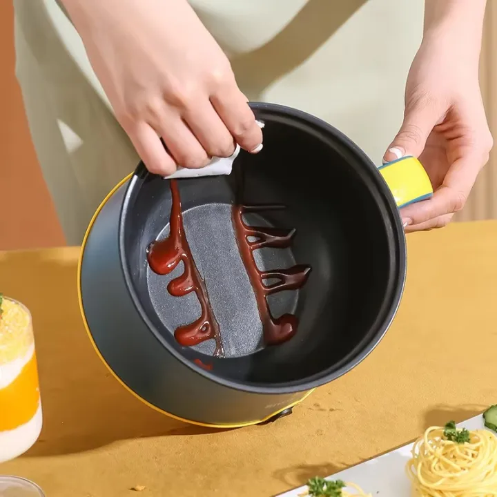 Portable%20Electric%20Multicooker%20Rice%20Cooker%20%E2%80%93%201.8L%20Stainless%20Steel%20Non-Stick%20Cooking%20Pot%20with%20Steamer,%20300W/600W%20Dual%20Power,%20Compact%20Travel%20Cooker%20for%20Rice,%20Noodles,%20Soups%20&%20Stews%20%E2%80%93%20Quick%20Heating%20Multipurpose%20Cooker%20for%20Home%20&%20Dorm%20Simplicity%20-%20Image%204