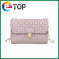 Ladies embossed one-shoulder chain small square bag Korean version of autumn and winter bag lid lock small bag. 